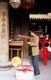 China: Placing incense at an altar in the Guandi Temple dedicated to General Guan Yu, the Three Kingdoms' hero turned God of War, Quanzhou, Fujian Province